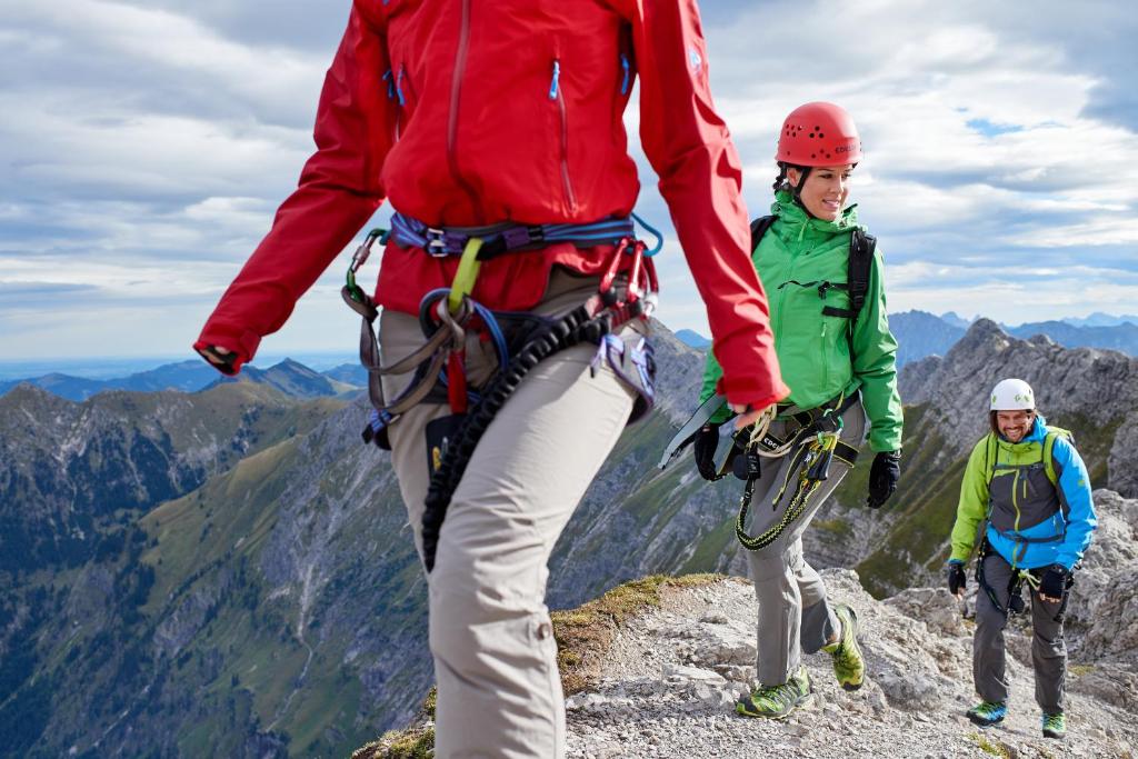 a group of people hiking on a mountain at Explorer Hotel Montafon in Gaschurn