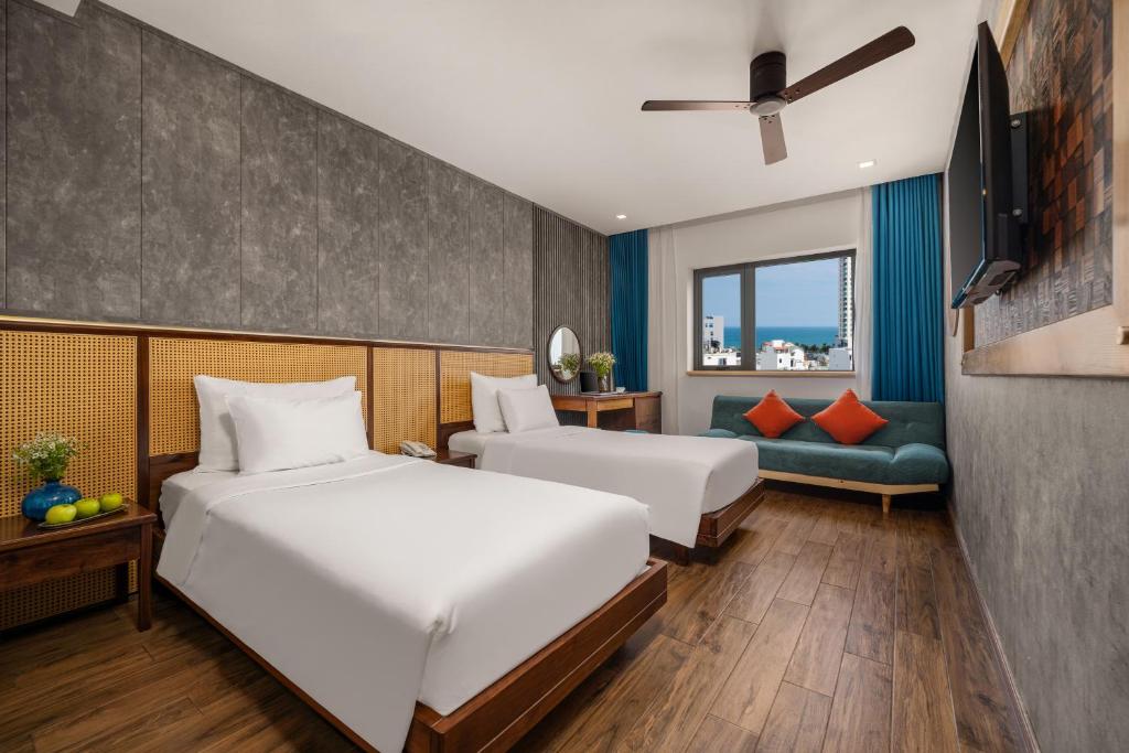 Giường trong phòng chung tại White Sand Boutique Hotel
