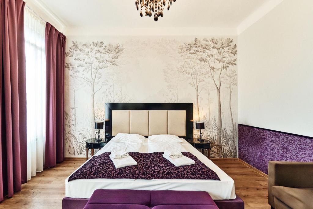 Postel nebo postele na pokoji v ubytování Hotel Pension Baron am Schottentor