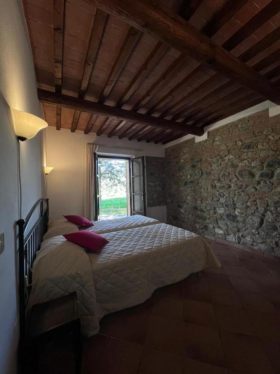 Postel nebo postele na pokoji v ubytování Relais La Pieve Vecchia