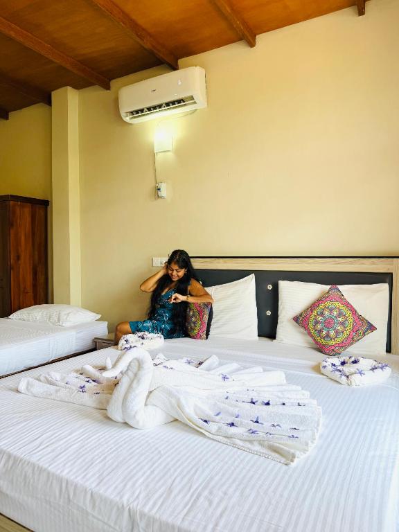 Postel nebo postele na pokoji v ubytování Elepath Lodge- Pinnawala