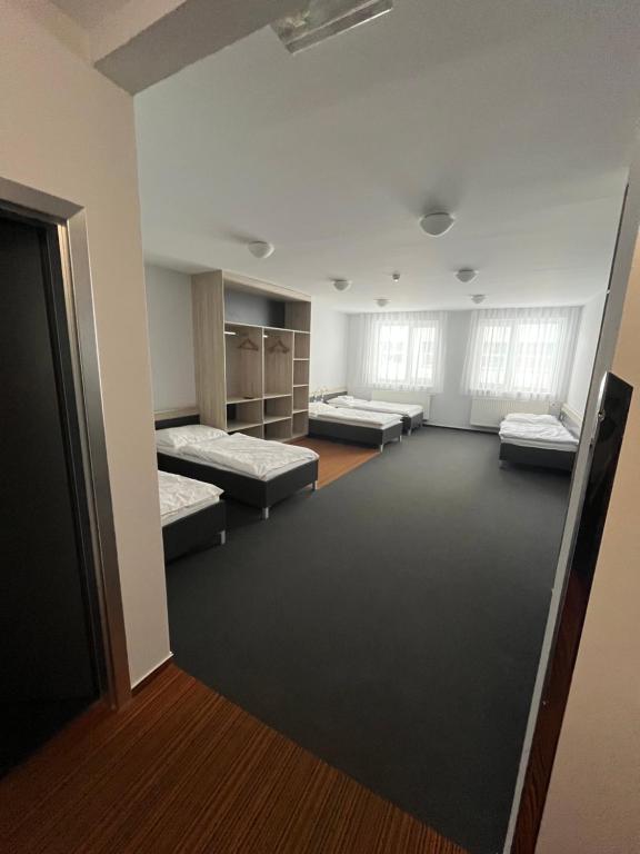 Postel nebo postele na pokoji v ubytování Buly Aréna