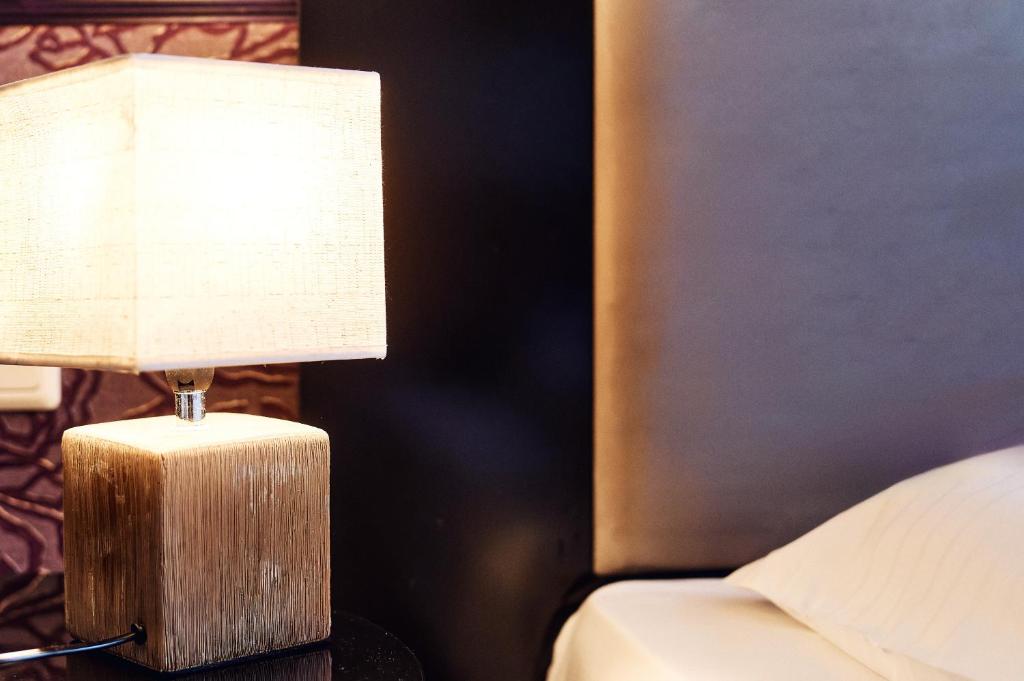 Postel nebo postele na pokoji v ubytování Hotel Pension Baron am Schottentor