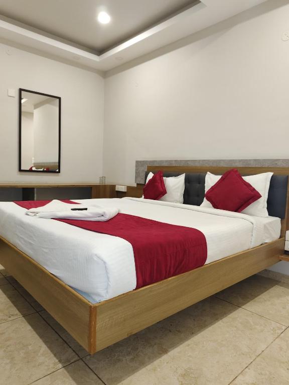Postel nebo postele na pokoji v ubytování Classio Residency