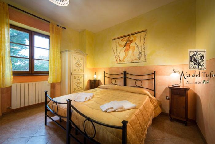 Postel nebo postele na pokoji v ubytování Bio Agriturismo Aia del Tufo