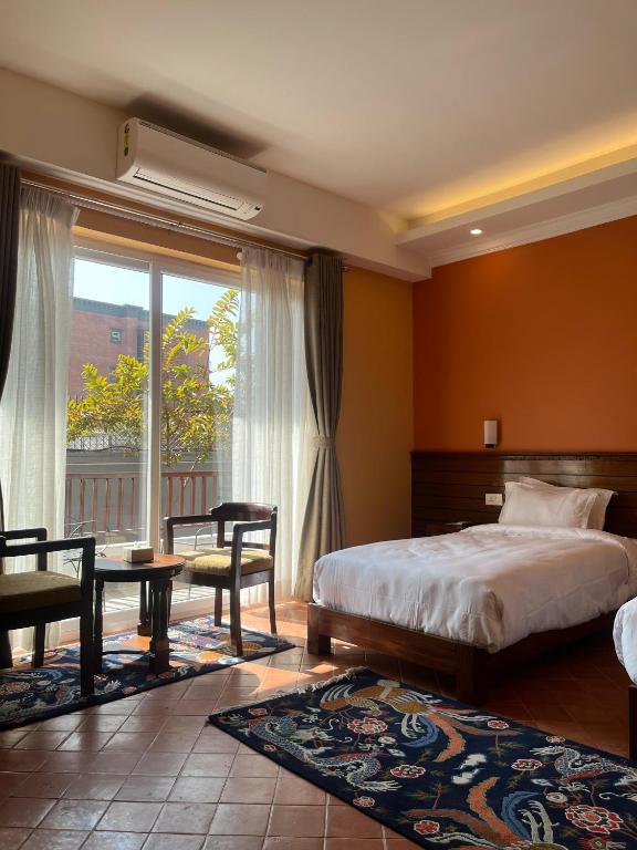 Voodi või voodid majutusasutuse Hotel Dolmaling toas