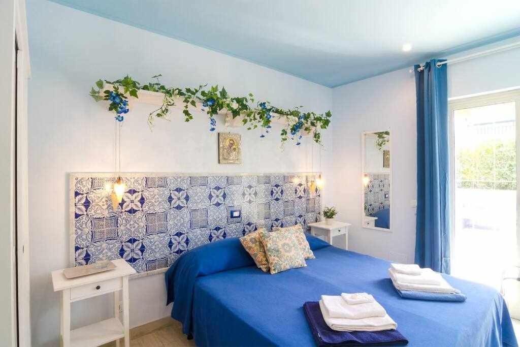 Postel nebo postele na pokoji v ubytování Mediterranean Charm villa con piscina al mare