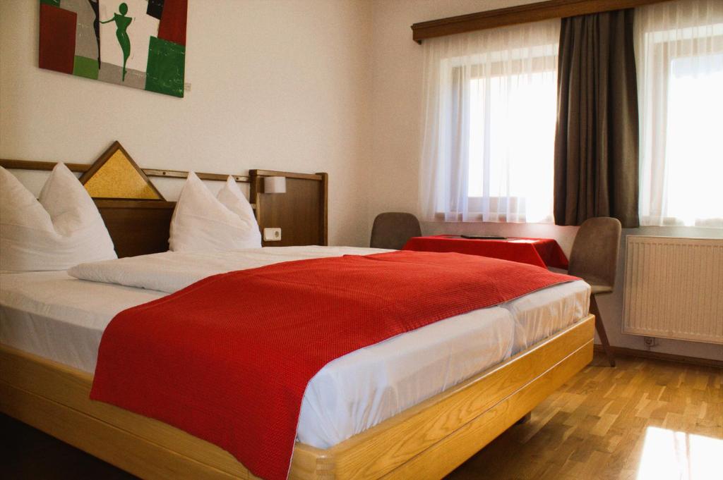 Postel nebo postele na pokoji v ubytování Gourmetbauernhof Mentebauer