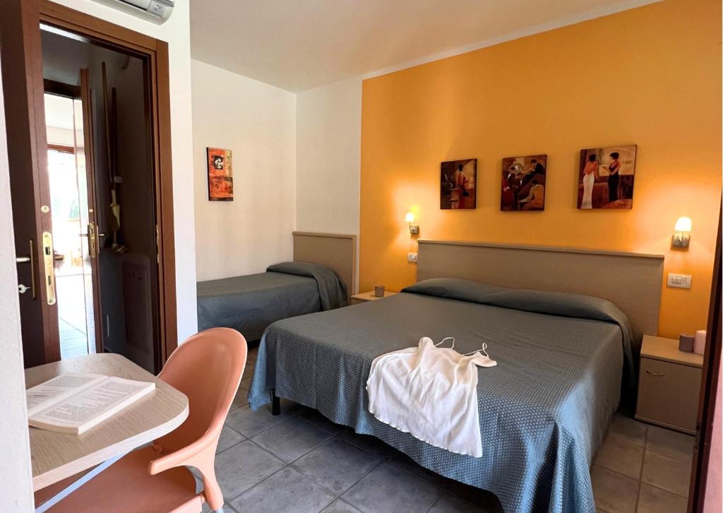 Postel nebo postele na pokoji v ubytování Residence Talamone Il Poderino