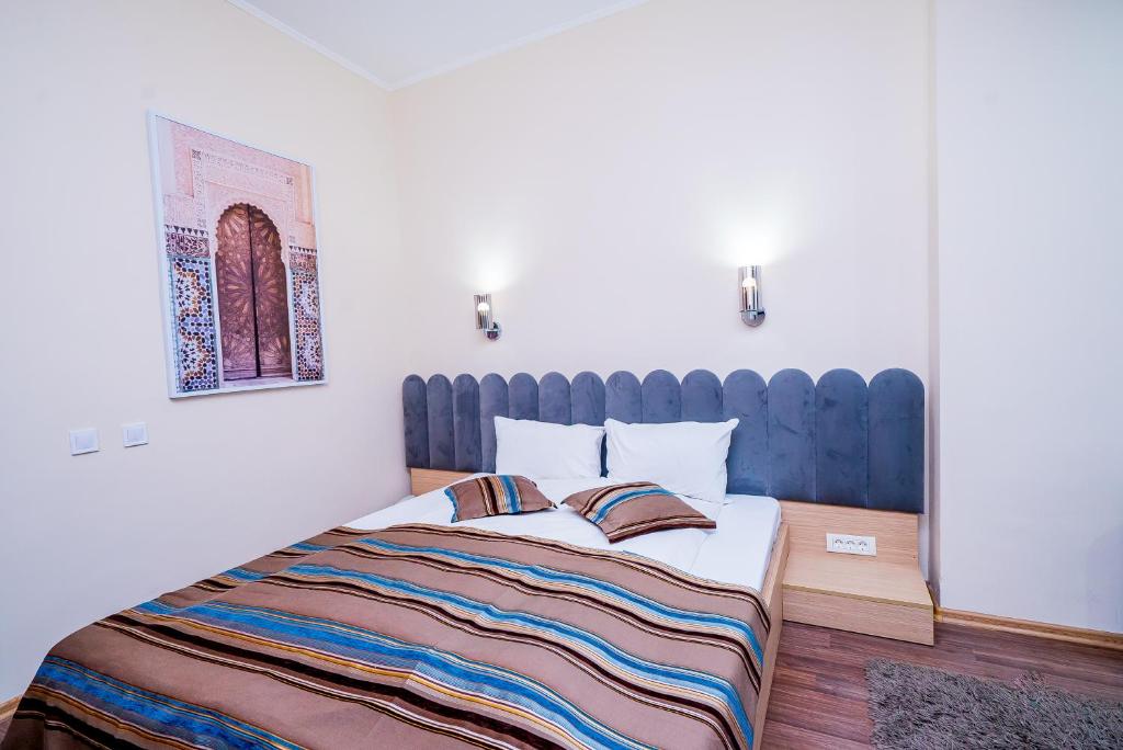 Postel nebo postele na pokoji v ubytování Guci Hotel