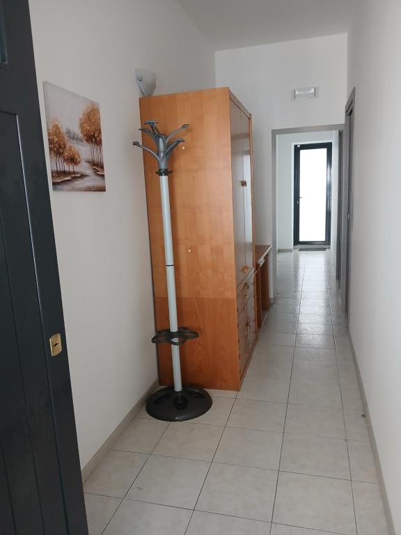 a hallway with a room with a toilet in it at MaGa House in Catania