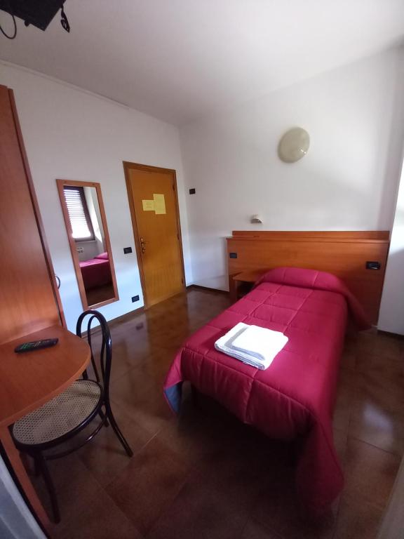Postel nebo postele na pokoji v ubytování Hotel Fontanella