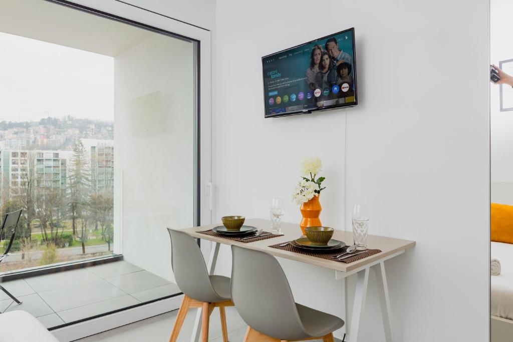 TV a/nebo společenská místnost v ubytování Campus Lugano {30 wonderful Smart Suites} in the university area