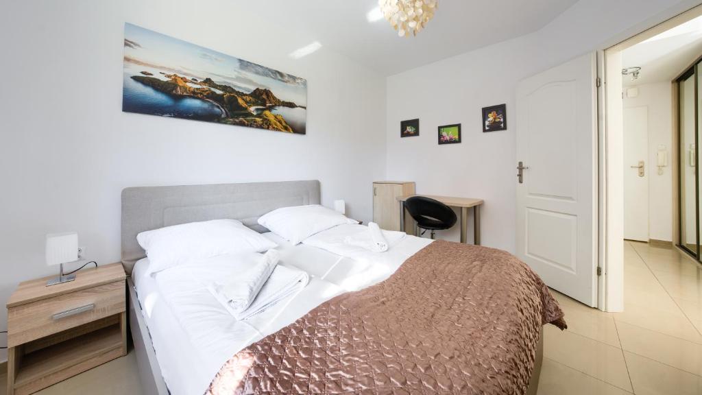 Posteľ alebo postele v izbe v ubytovaní Apartamenty Sun & Snow Kołobrzeg Jantar