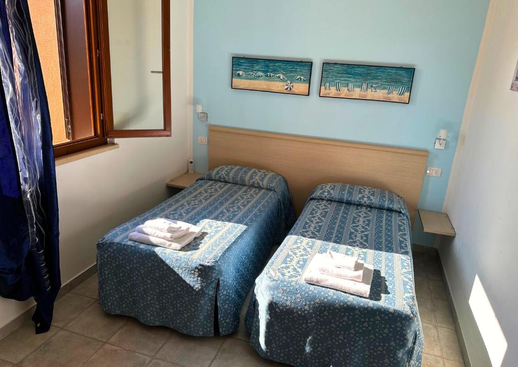 Postel nebo postele na pokoji v ubytování Residence Talamone Il Poderino