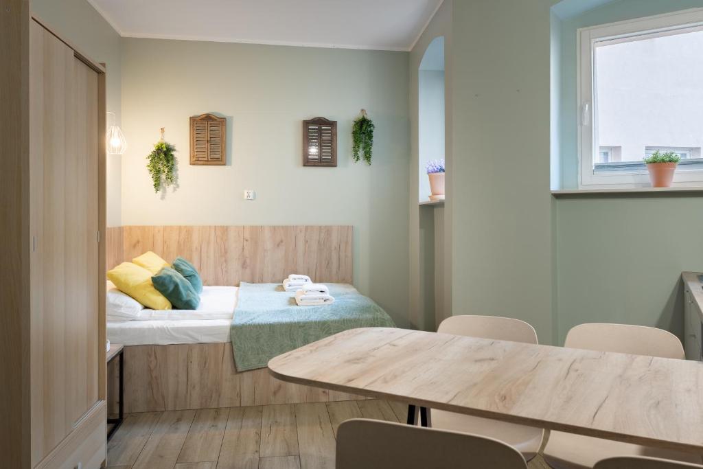 Posteľ alebo postele v izbe v ubytovaní Aparthotel przy Bulwarze by Rentoom