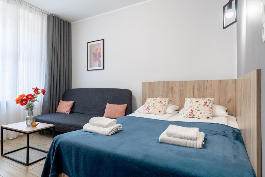 Posteľ alebo postele v izbe v ubytovaní Aparthotel przy Bulwarze by Rentoom