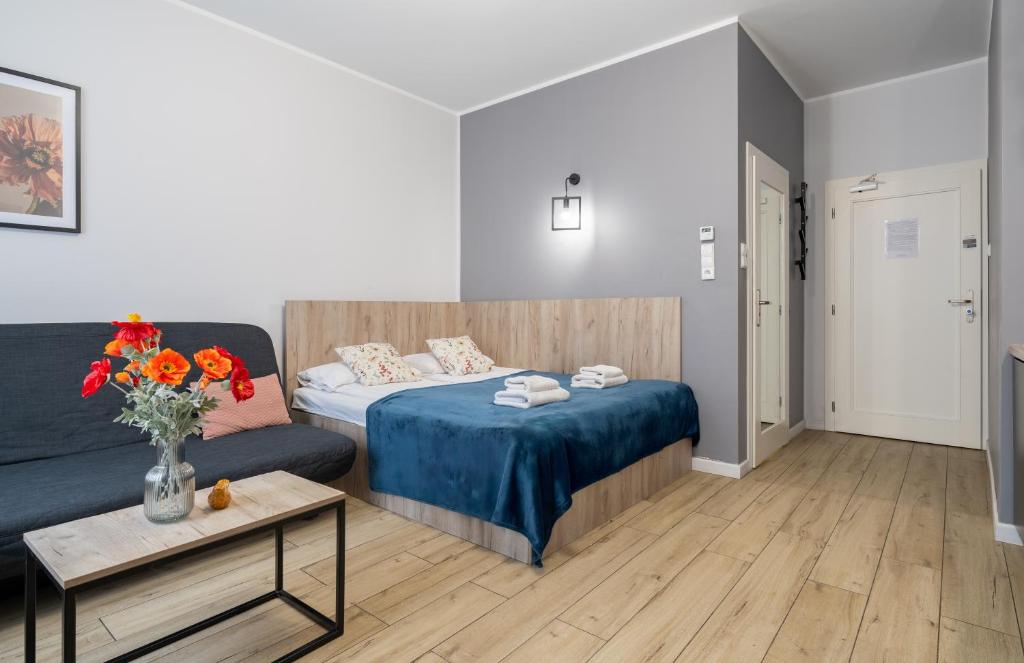 Posteľ alebo postele v izbe v ubytovaní Aparthotel przy Bulwarze by Rentoom