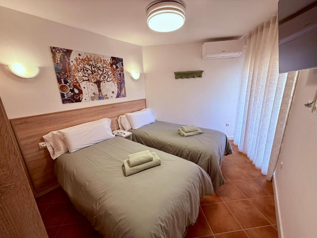 Postel nebo postele na pokoji v ubytování APARTAMENTO EN EL CENTRO CERCA DE La PLAYA