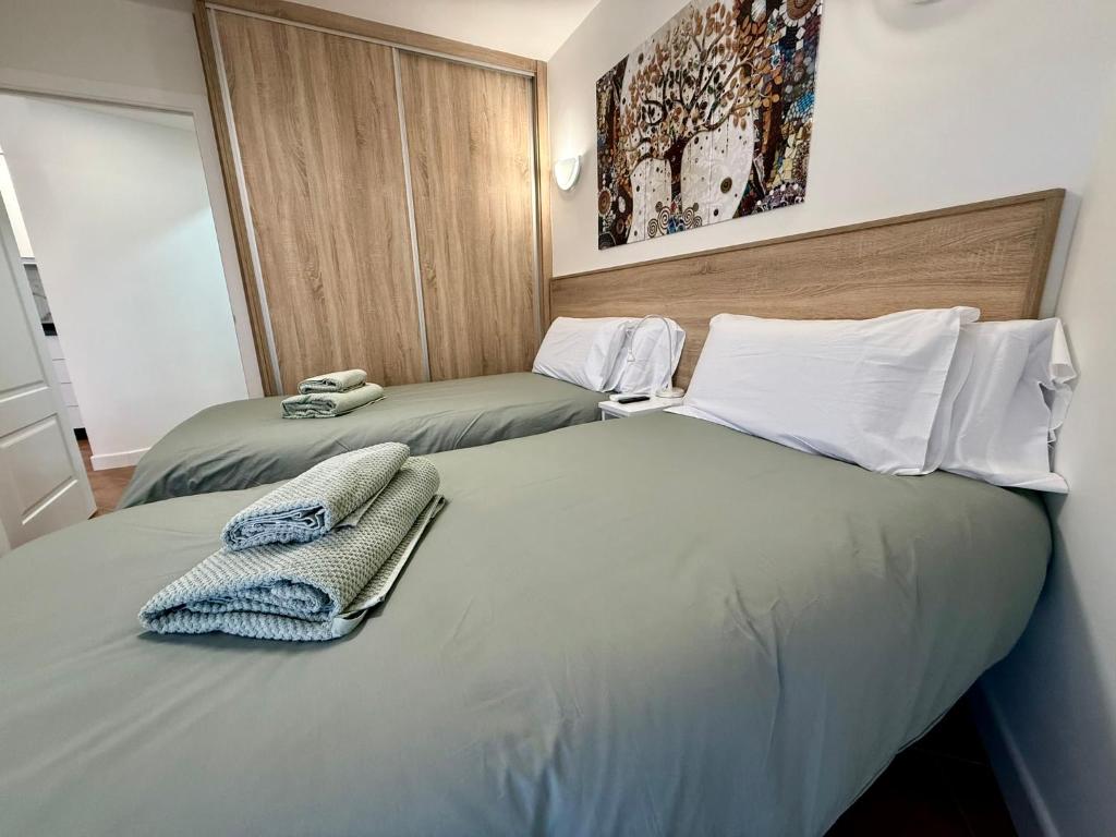 Postel nebo postele na pokoji v ubytování APARTAMENTO EN EL CENTRO CERCA DE La PLAYA