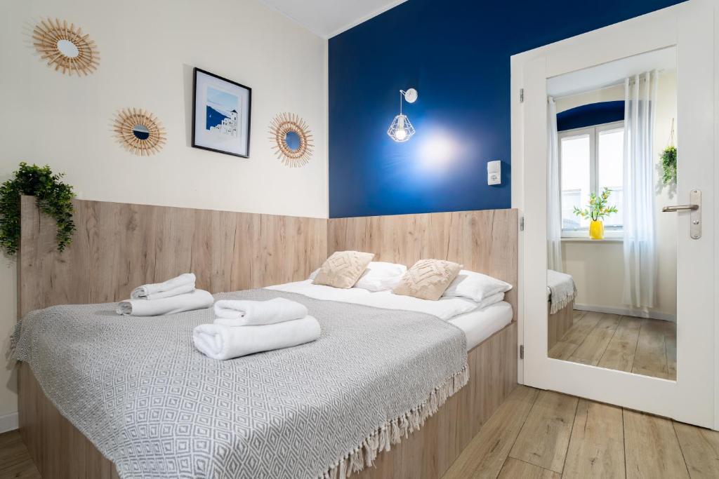 Posteľ alebo postele v izbe v ubytovaní Aparthotel przy Bulwarze by Rentoom