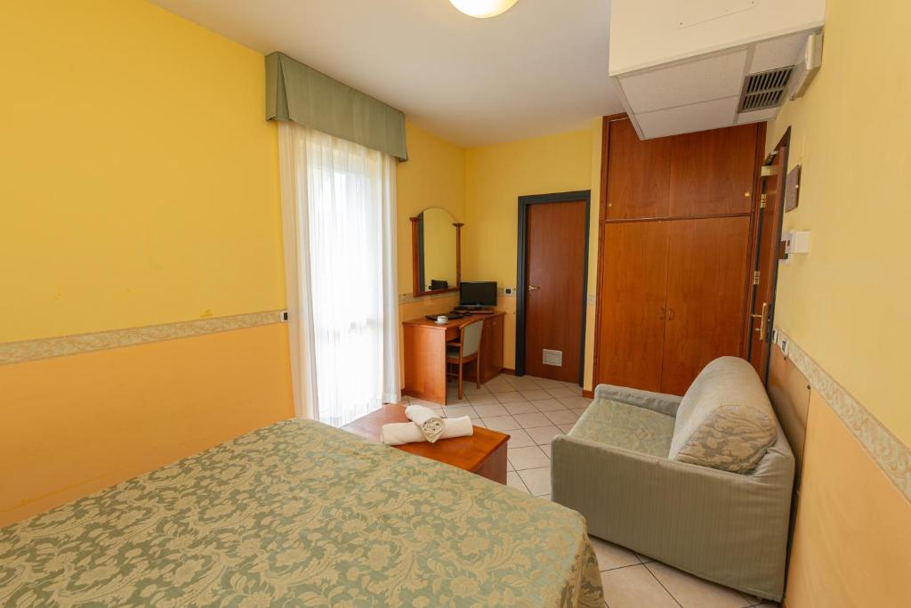 Postel nebo postele na pokoji v ubytování Hotel Roma Sul Mare