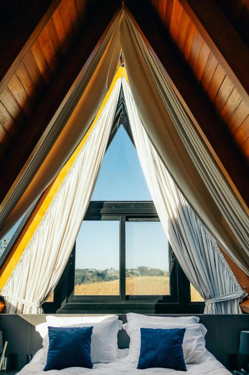 Postel nebo postele na pokoji v ubytování Alpinada Cabanas