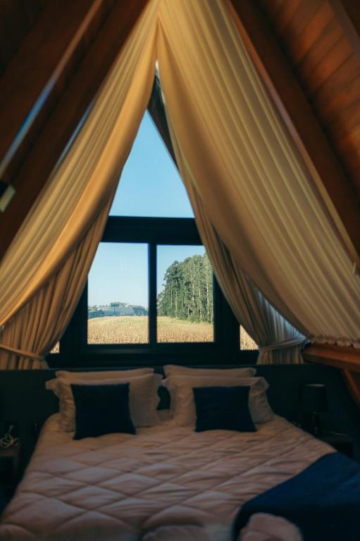 Postel nebo postele na pokoji v ubytování Alpinada Cabanas