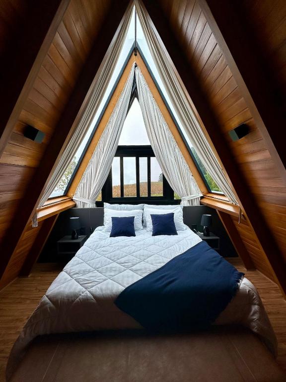 Postel nebo postele na pokoji v ubytování Alpinada Cabanas