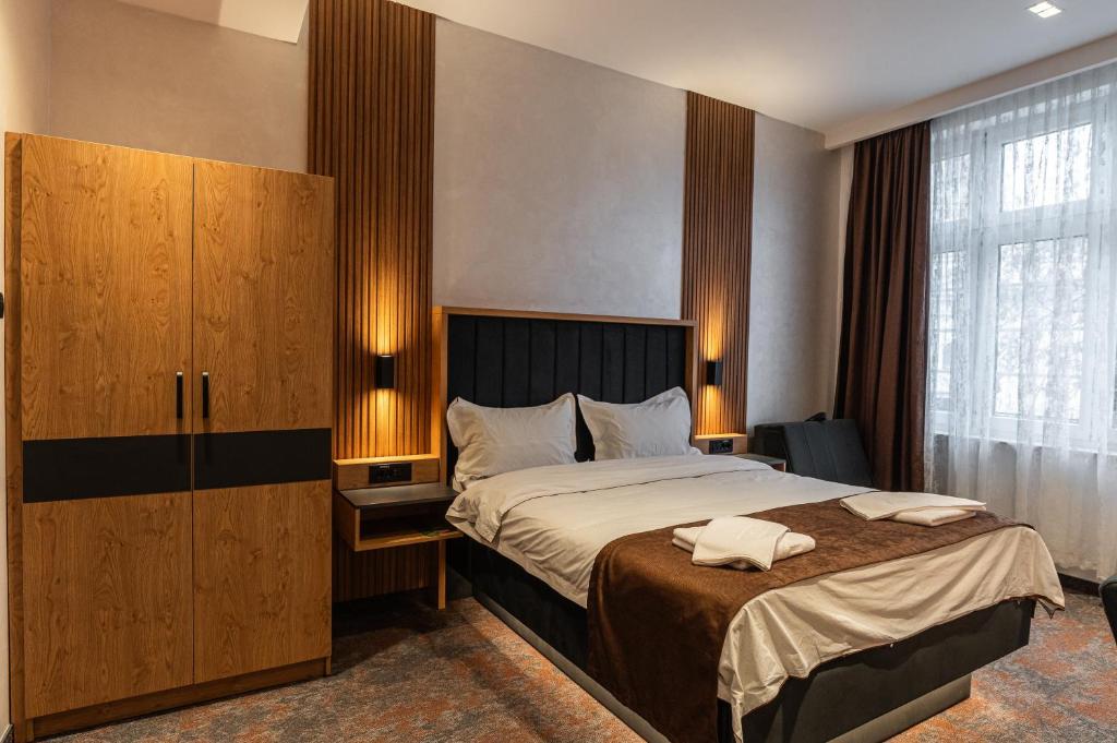 Postel nebo postele na pokoji v ubytování Hotel Astral