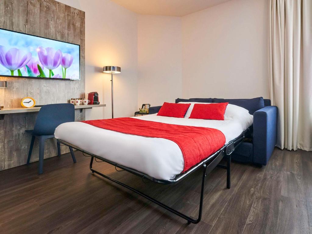 Postel nebo postele na pokoji v ubytování ibis Styles Almere