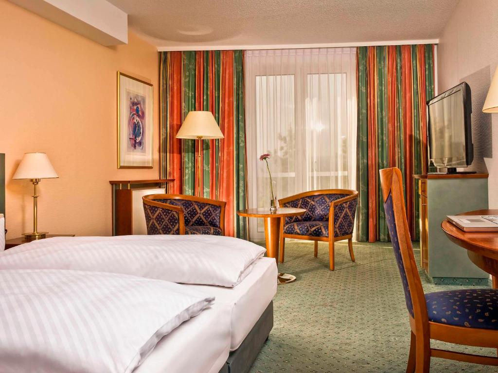 Letto o letti in una camera di Congress Hotel Weimar by Mercure