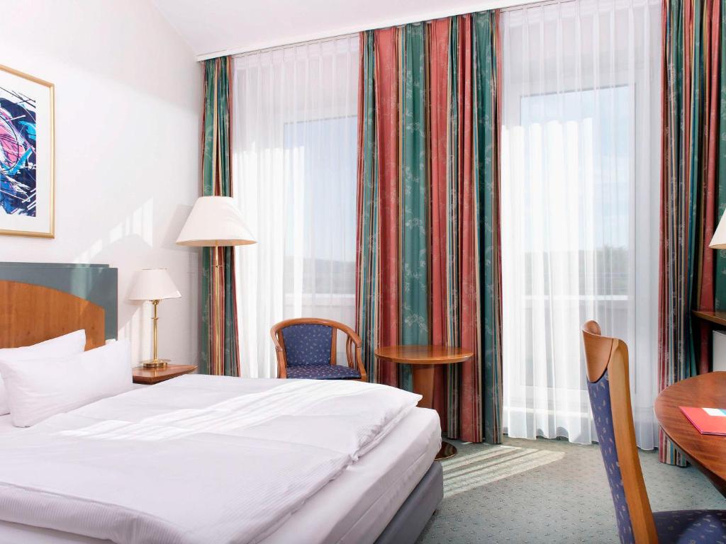 Letto o letti in una camera di Congress Hotel Weimar by Mercure