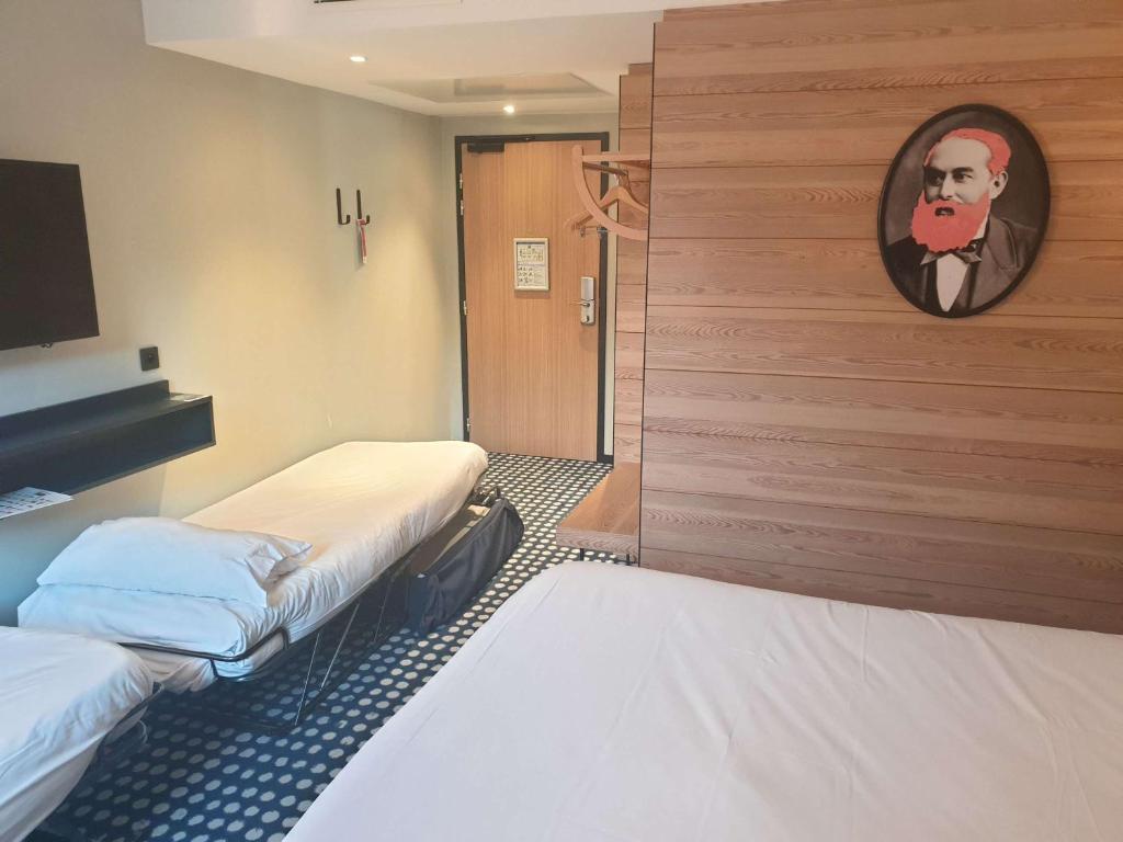 Postel nebo postele na pokoji v ubytování ibis Styles Albertville
