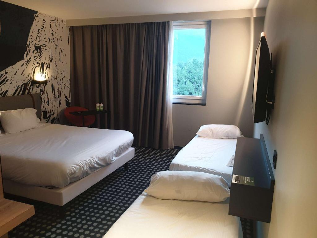 Postel nebo postele na pokoji v ubytování ibis Styles Albertville