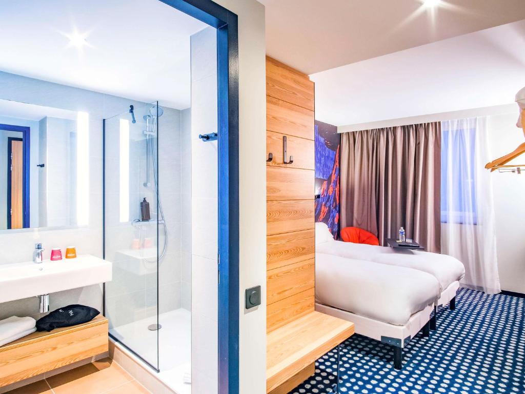 Postel nebo postele na pokoji v ubytování ibis Styles Albertville