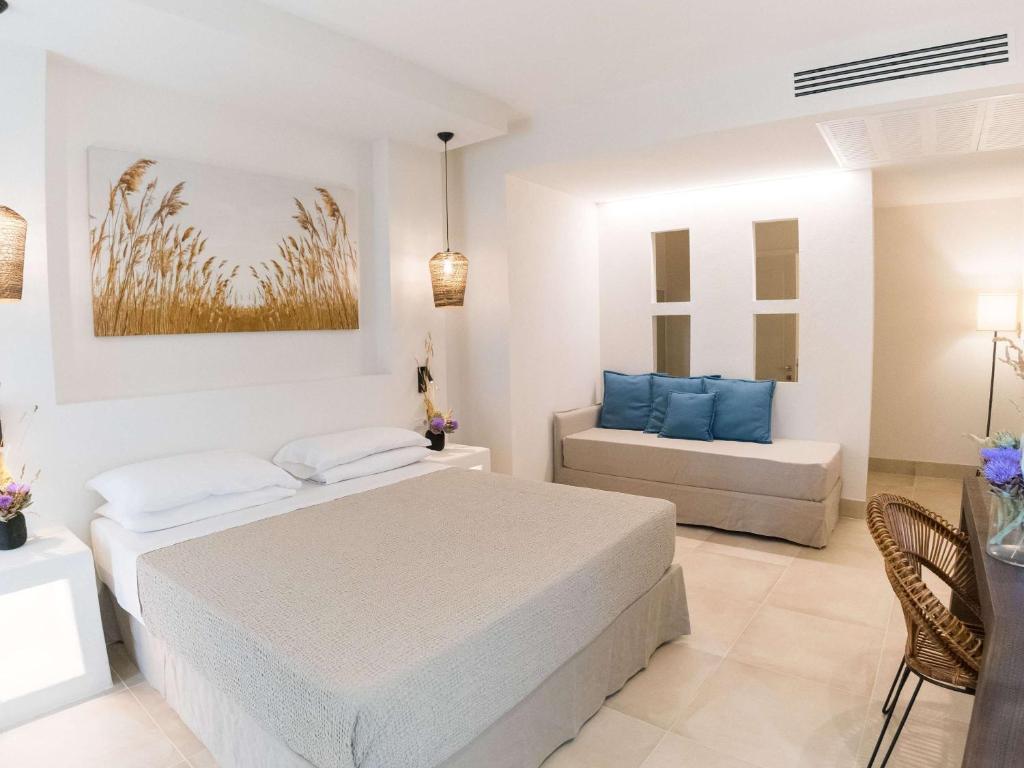 Postel nebo postele na pokoji v ubytování Hotel Baia Delle Zagare