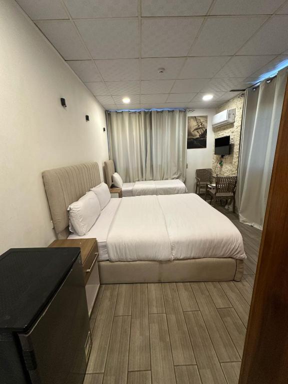 Postel nebo postele na pokoji v ubytování cairo jordan hotel