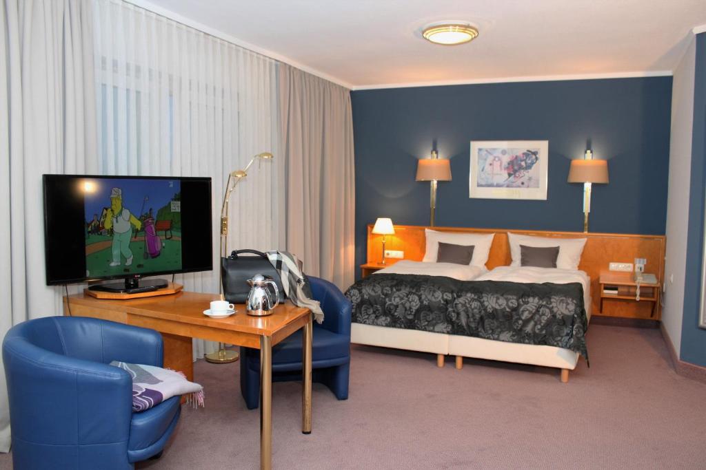Postel nebo postele na pokoji v ubytování Grunau Hotel