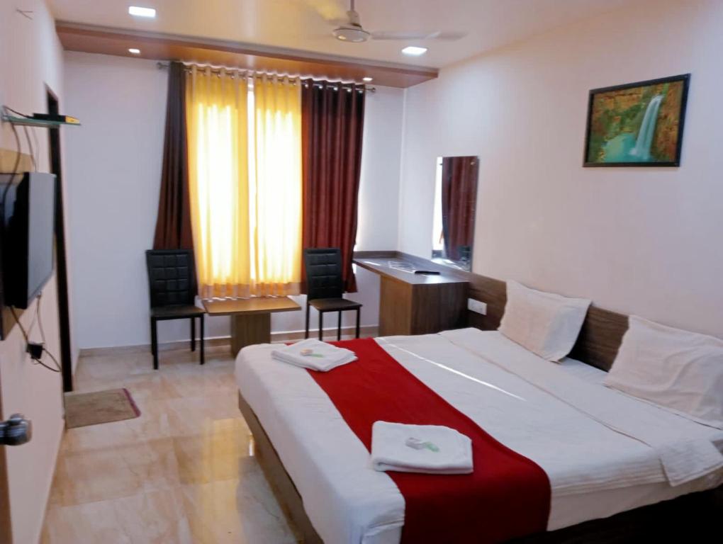 Postel nebo postele na pokoji v ubytování Hotel Gir Scintilla