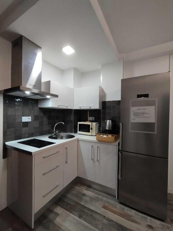 Kuchyň nebo kuchyňský kout v ubytování Plazamar Centro Apto 1 Dorm 3 Huésped Playa WiFi