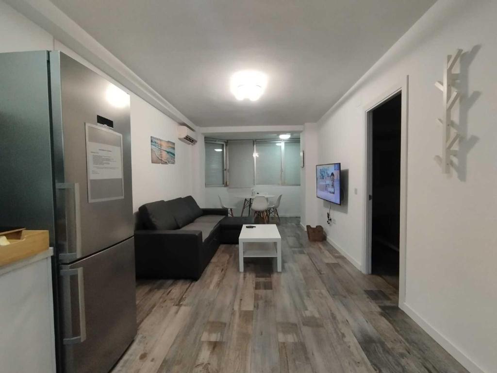 TV a/nebo společenská místnost v ubytování Plazamar Centro Apto 1 Dorm 3 Huésped Playa WiFi
