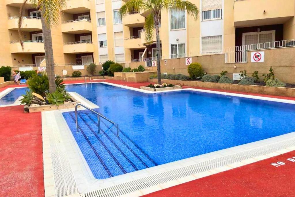 a large swimming pool in front of a building at Casa Brisa Mediterranea by Rental Hero in Los Alcázares