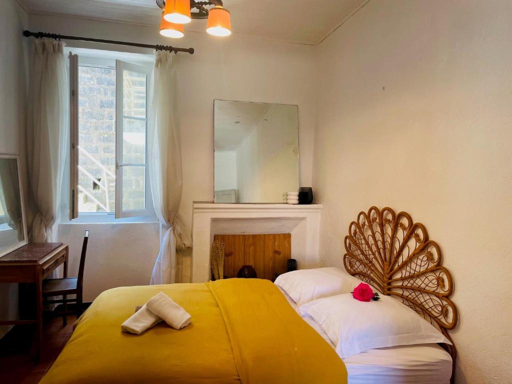 Ένα ή περισσότερα κρεβάτια σε δωμάτιο στο Maison centre village ZONZA