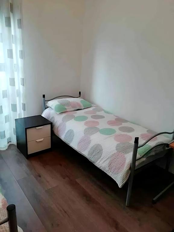 A bed or beds in a room at Gorizia Central Luxe Apartment 6 posti letto