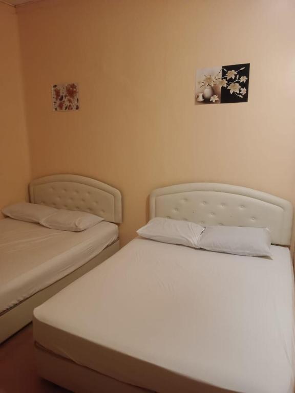 Postel nebo postele na pokoji v ubytování Wonderful Motel