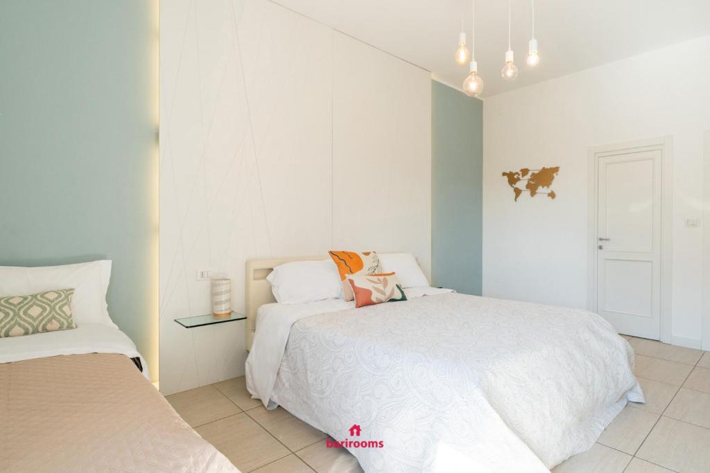 Postel nebo postele na pokoji v ubytování BARI ROOMS Suite Station