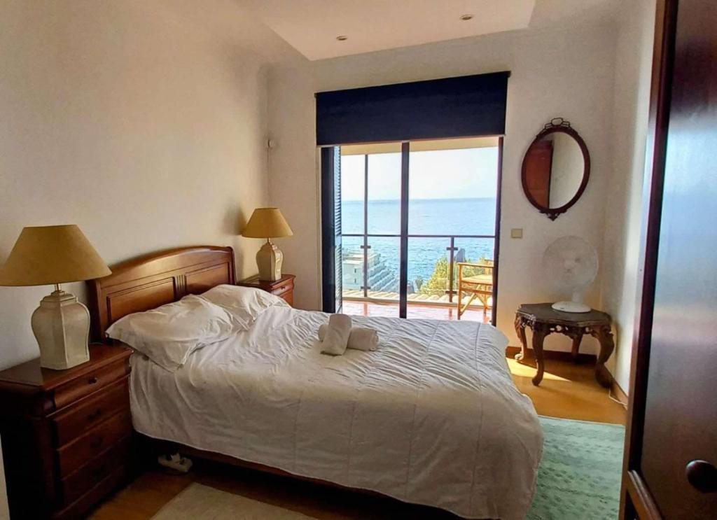 Postel nebo postele na pokoji v ubytování Lido ocean front penthouse