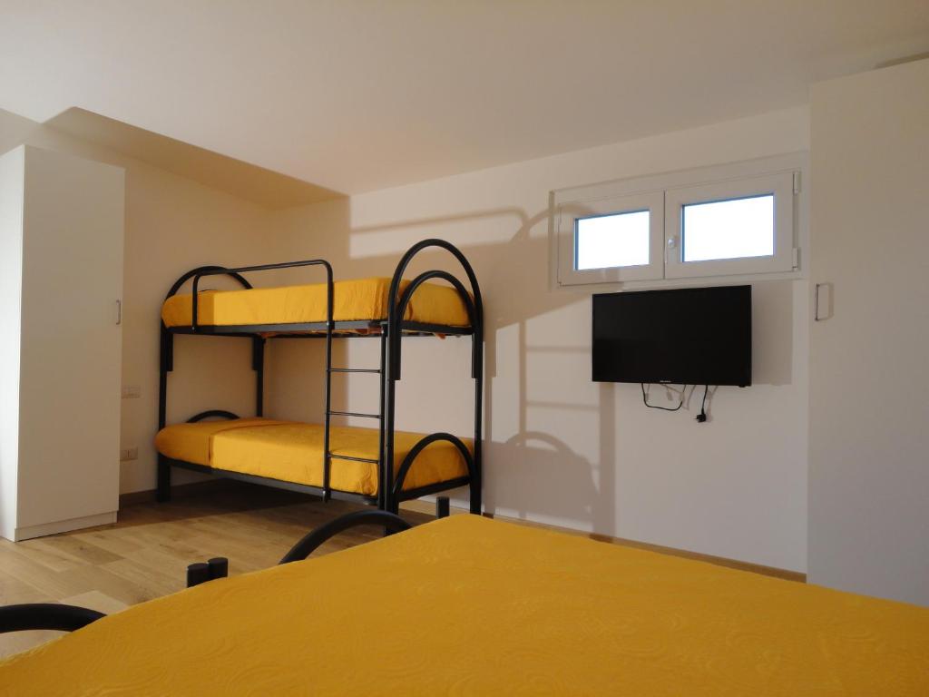 Postel nebo postele na pokoji v ubytování Pavia Ostello
