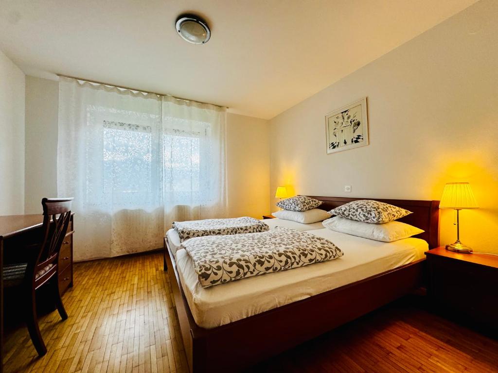 Postel nebo postele na pokoji v ubytování Villa Bohinj